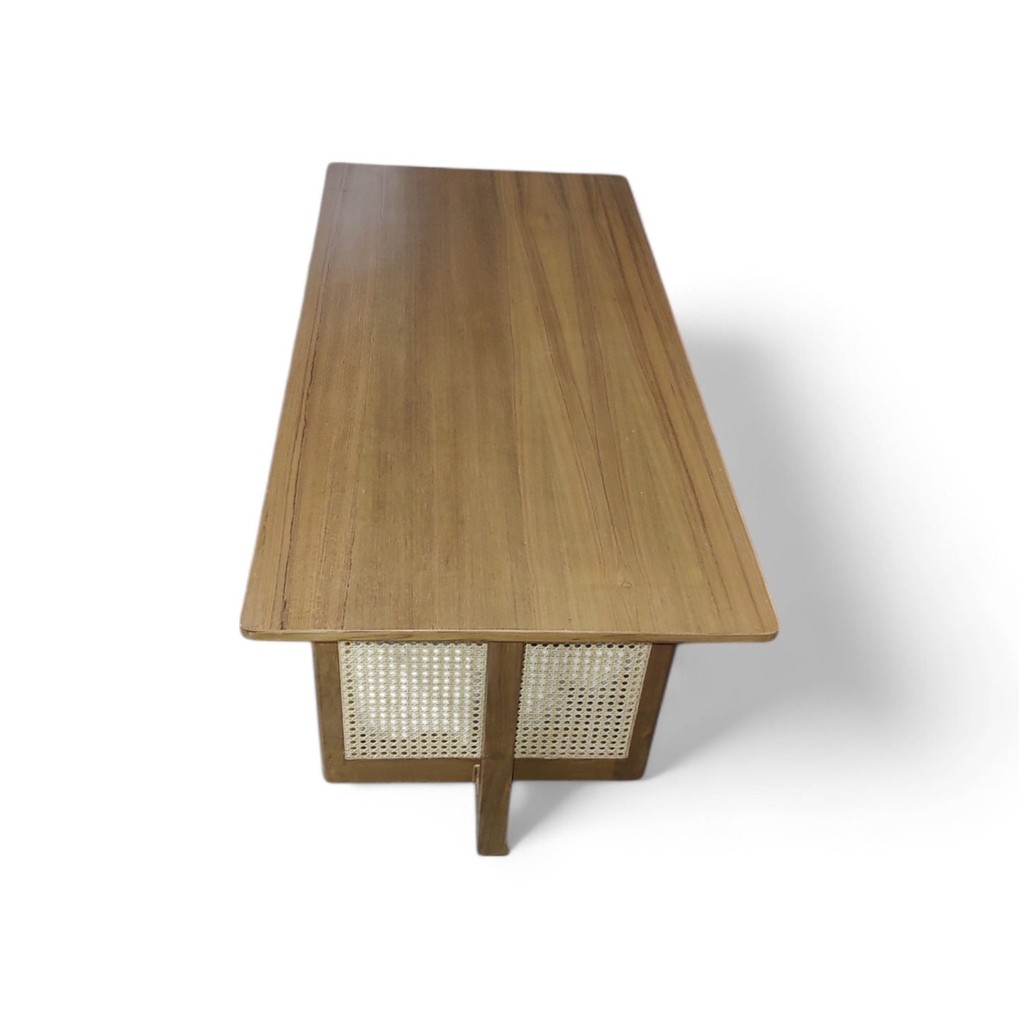Elevate Your Living Room with Our Stunning Teak Wood Coffee Table Featuring Natural Cane Weaving. The Teak Colour Matte Finish adds a Touch of Warmth and Sophistication.