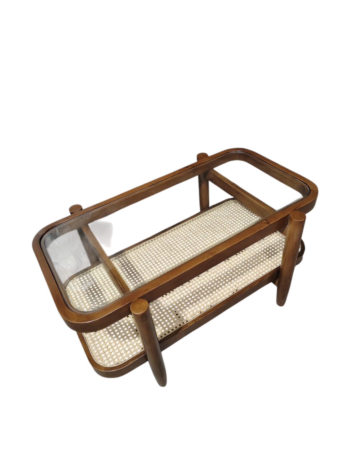 The glass top surface and lower cane woven shelf provide ample space for display and storage in your living room